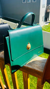 DiwaKi Heritage Muse Handbag – Luxury Leather Satchel with Gold African Emblem