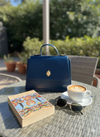 DiwaKi Heritage Muse Handbag – Luxury Leather Satchel with Gold African Emblem